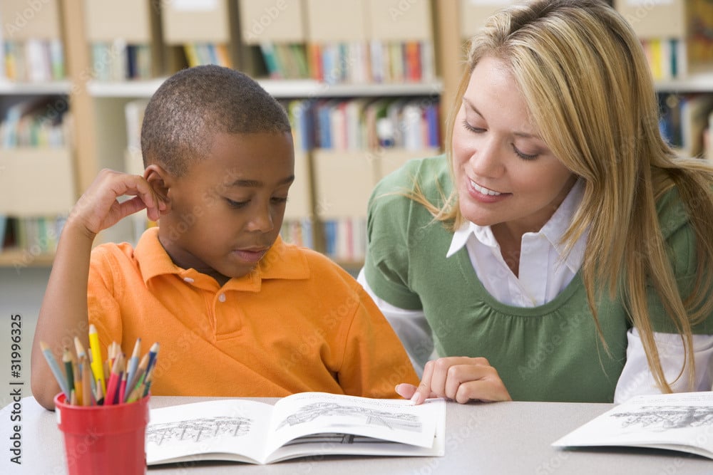 Teacher with elementary student